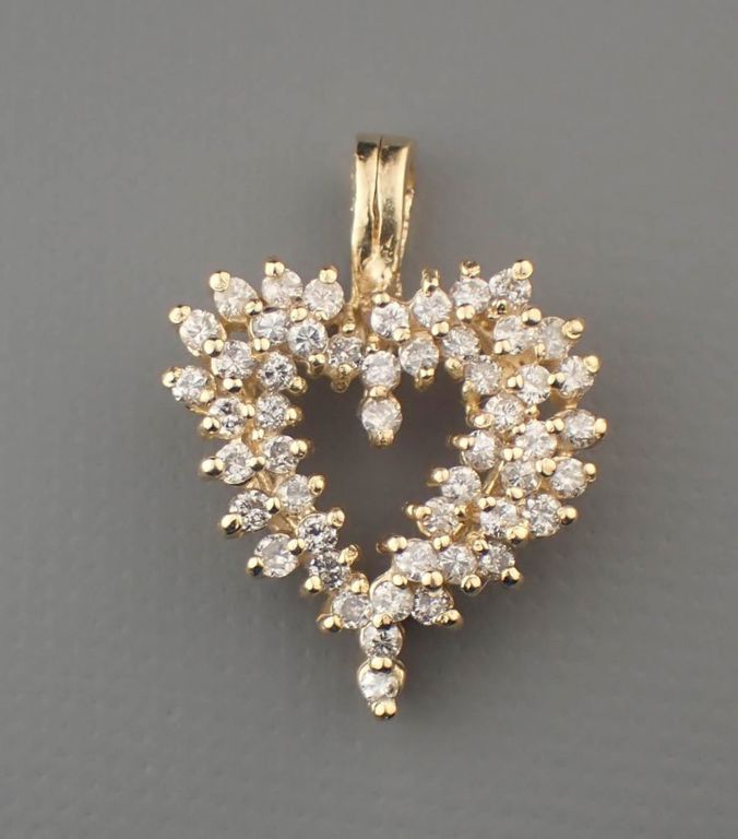 Diamond and 14k yellow gold heart pendant