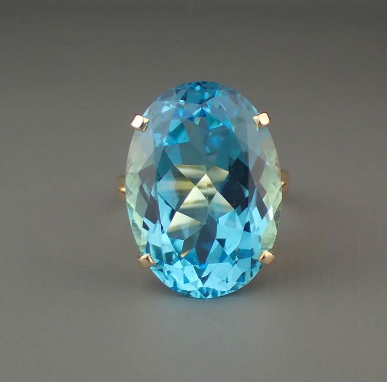 Blue topaz and 14k yellow gold ring