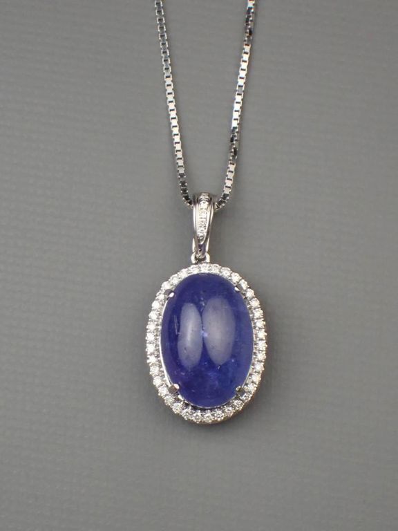 Tanzanite and diamond halo pendant necklace