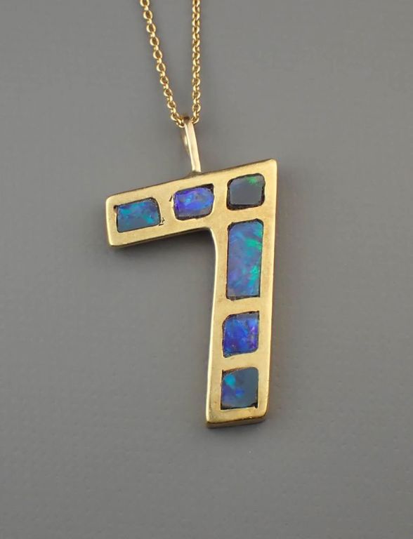 Black opal and 18k gold pendant necklace