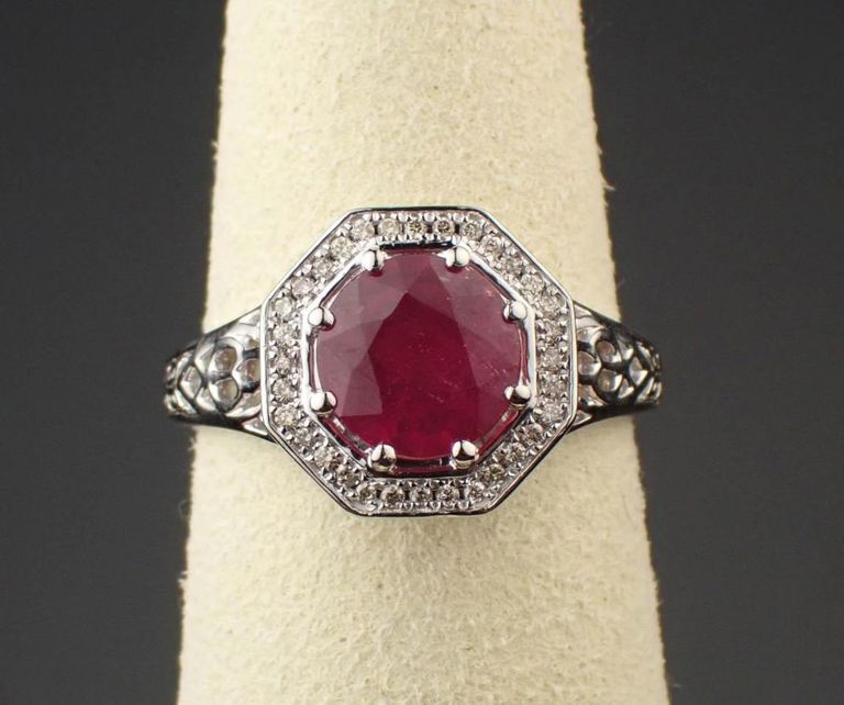 Ruby, diamond halo and platinum ring