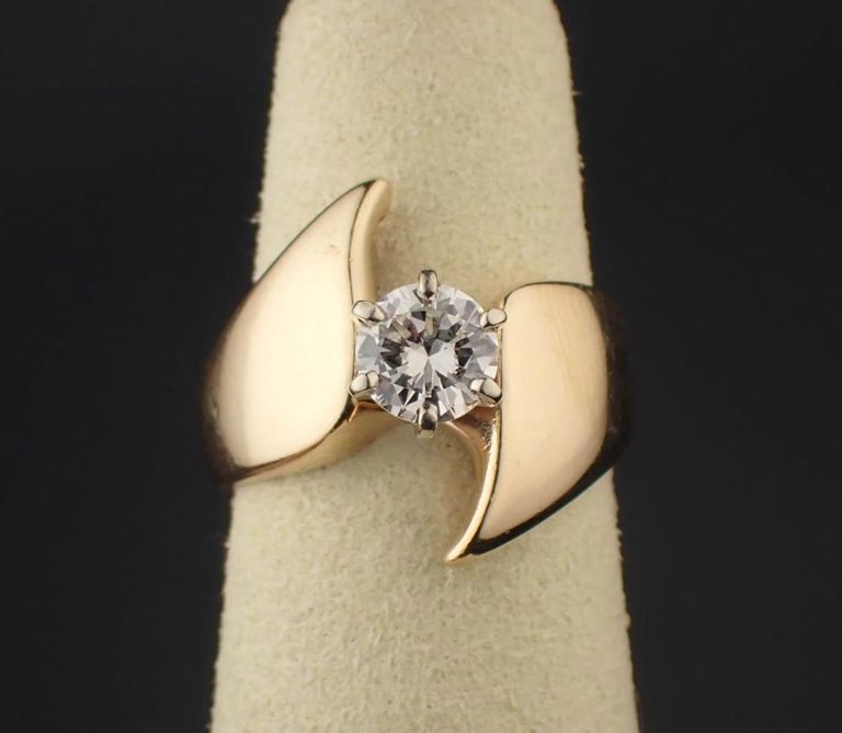 Diamond and 14k yellow gold solitaire ring