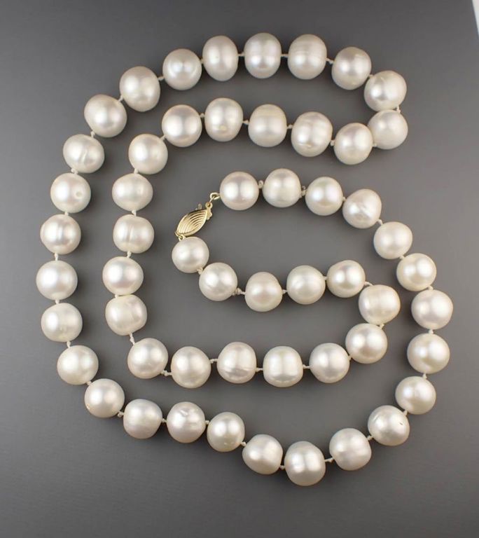 Opera length pearl and gold necklace