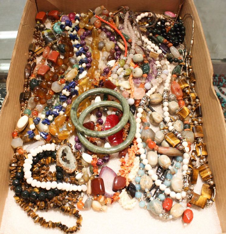 Tray of jewelry: bracelets and stone beaded necklaces