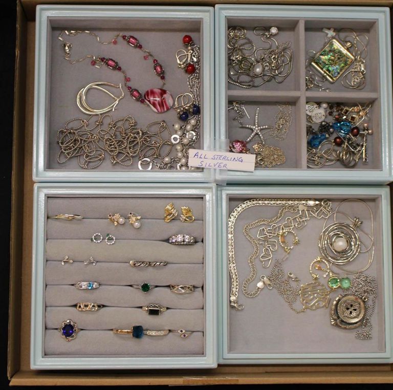 Tray of sterling silver jewelry: rings, necklaces, earrings, etc.
