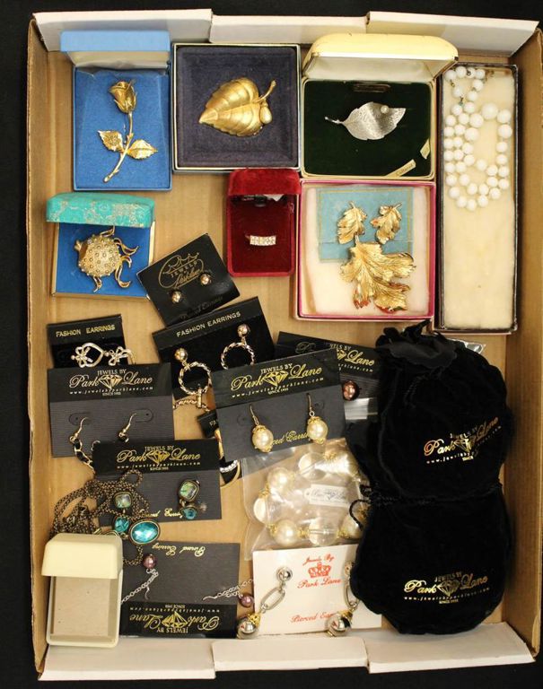 Tray of jewelry: earrings, necklaces, pendants, brooches, etc. Many by Park Lane
