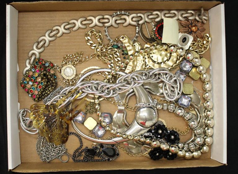Tray of jewelry: necklaces, bracelets, hair comb