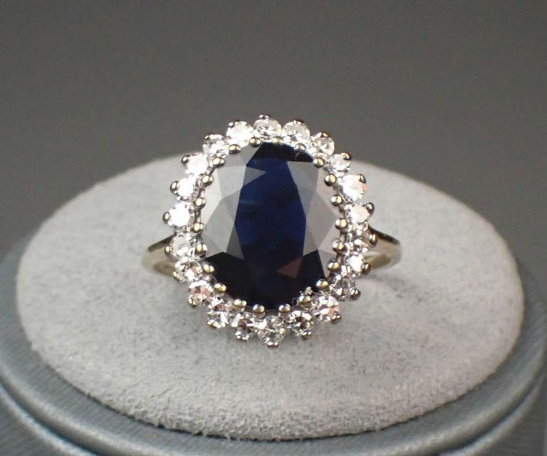 Sapphire, diamond halo and two-tone gold ring