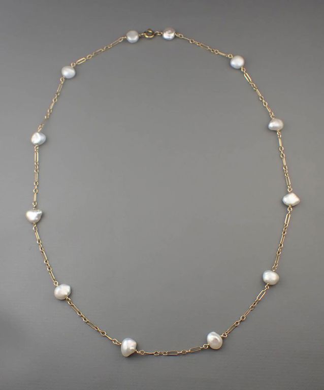 Pearl and 14k gold station necklace