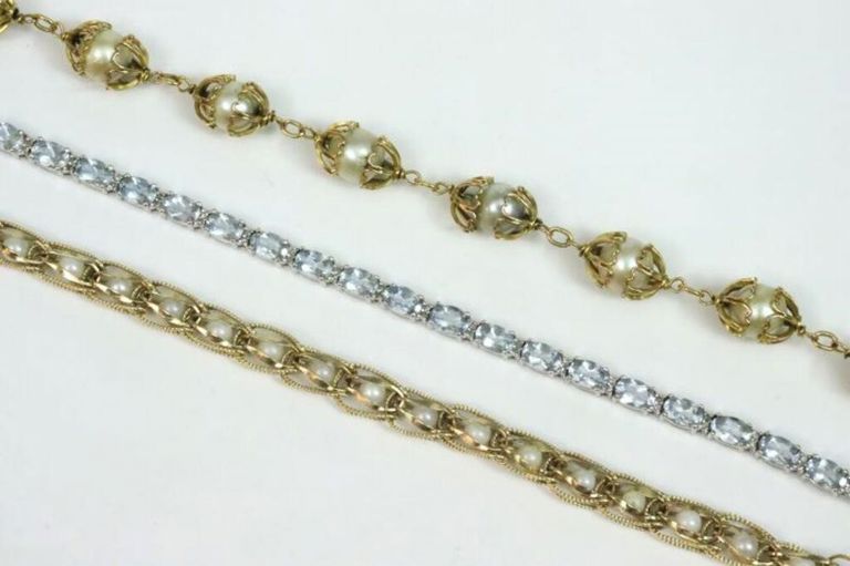 Gold bracelets with gemstones and pearls