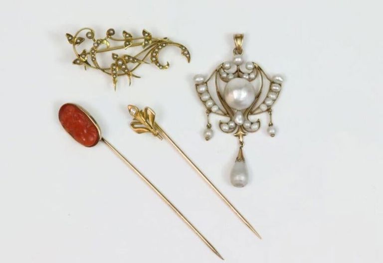 Group of gold jewelry pieces
