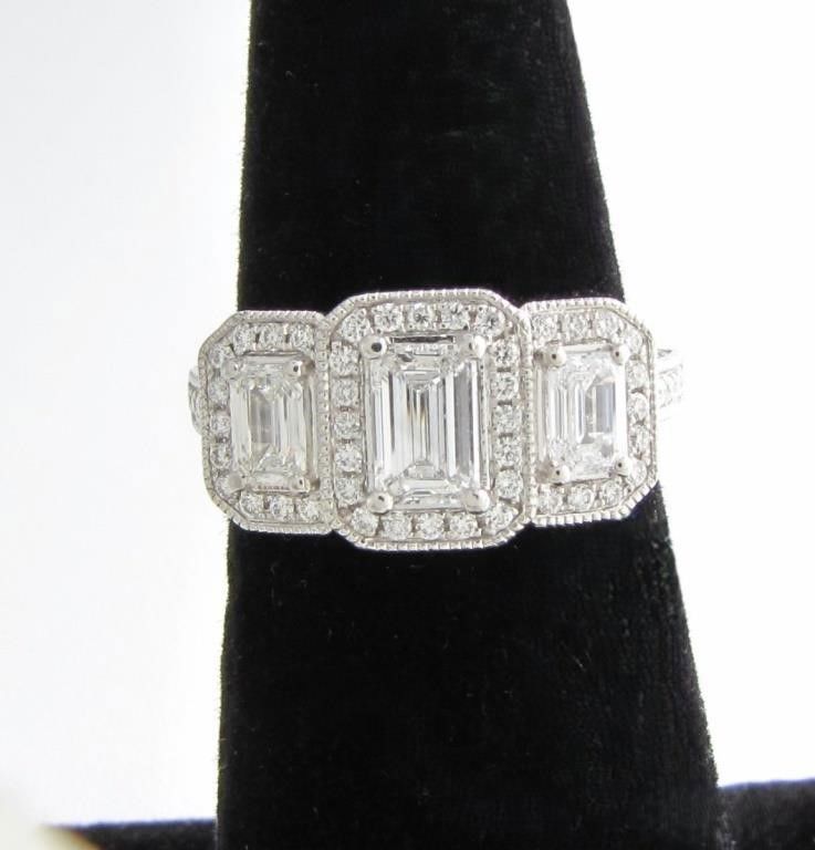 Platinum emerald cut 3-diamond ring