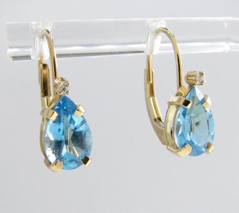 Pair of 14k yellow gold blue topaz earrings