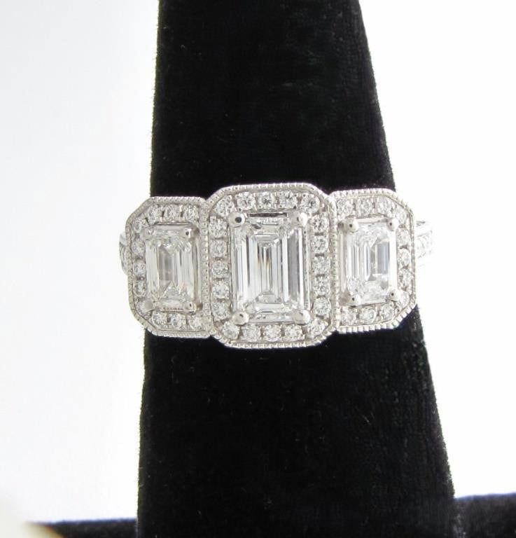 Platinum emerald cut 3-diamond ring