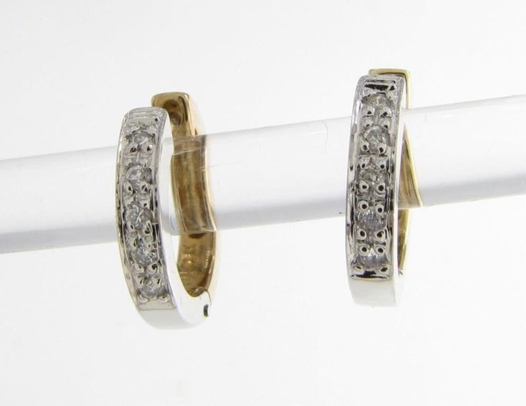 Pair of 14k two tone gold diamond huggie earrings