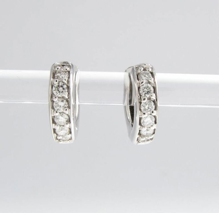 Pair of 14k white gold diamond huggie earrings
