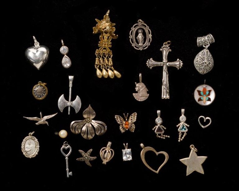 Group of Twenty Four Sterling Silver Pendants.