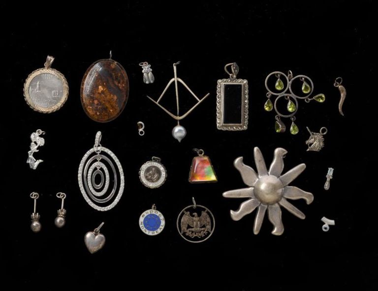 Twenty-one Sterling Pendants and Charms.