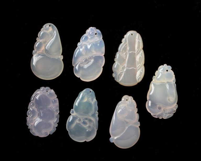Seven Carved Jade Chinese Pendants.