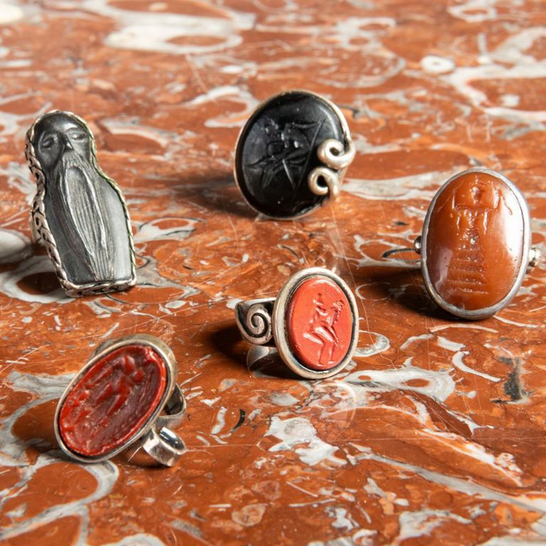 Group of Five Silver-Mounted Hardstone Rings