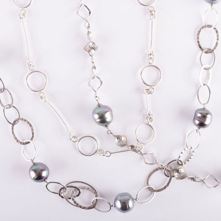 Two sterling silver and baroque pearl necklaces and a link necklace