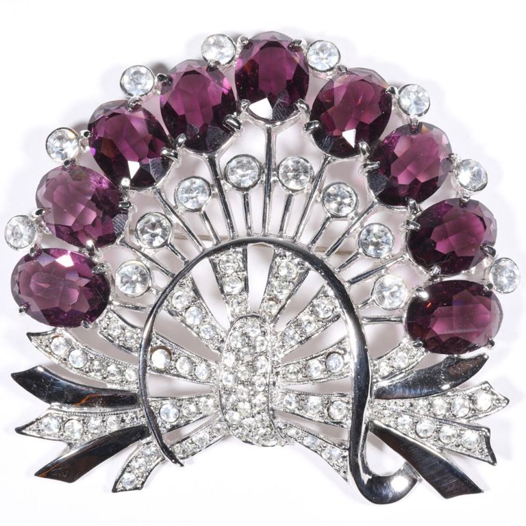 Rhodium plated bow and floral spray brooch with amethyst crystals and rhinestones