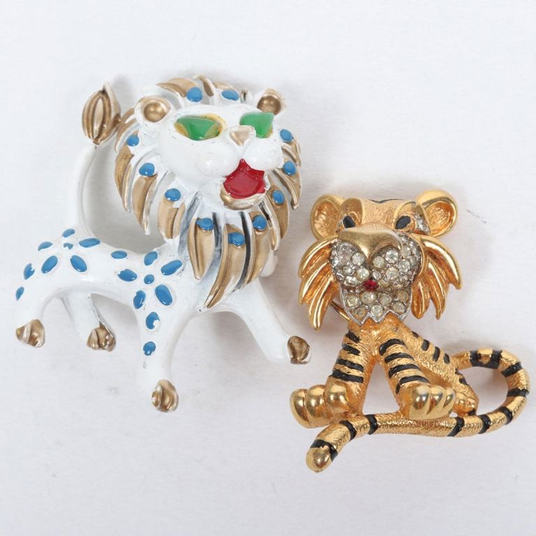 Rhinestone and enamel gold tone tiger brooch and white enamel lion brooch