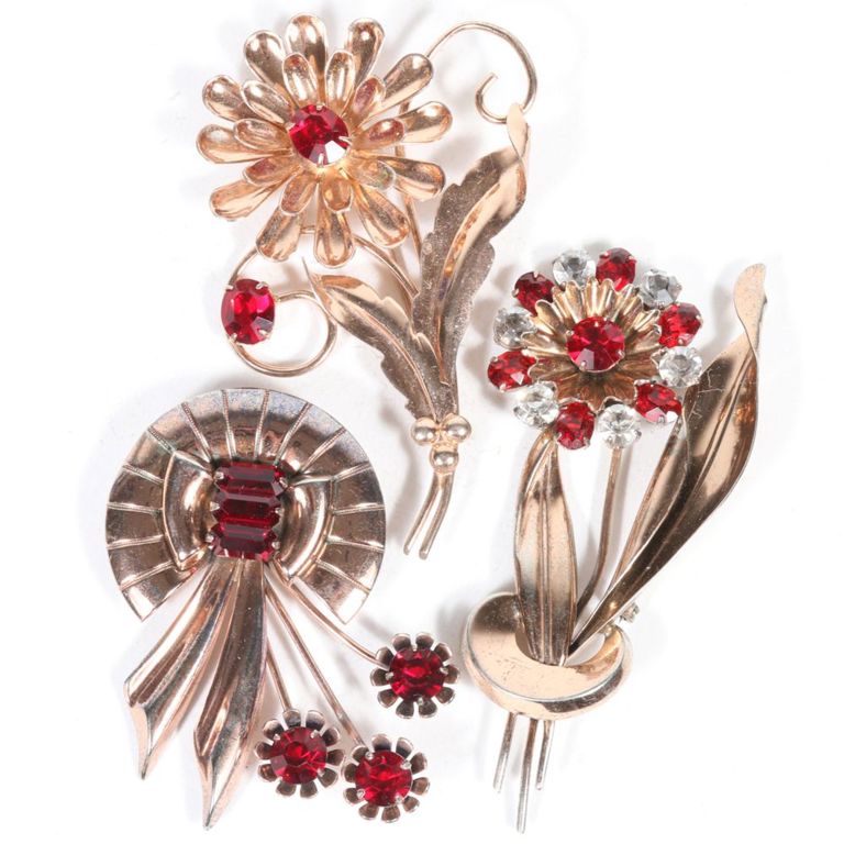 Three sterling vermeil floral brooches with ruby red faceted gems