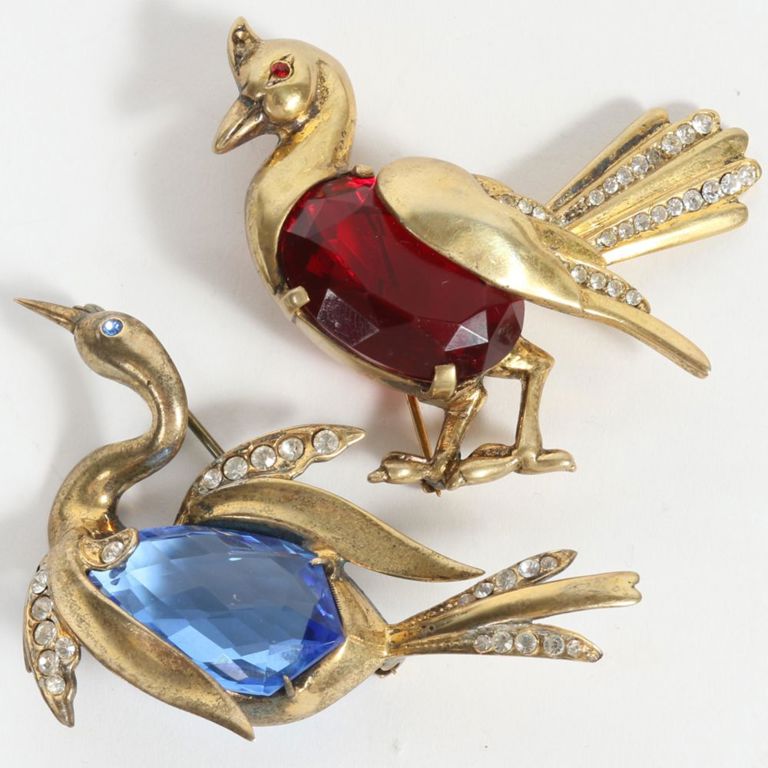 Two sterling vermeil bird brooches with red and blue stones