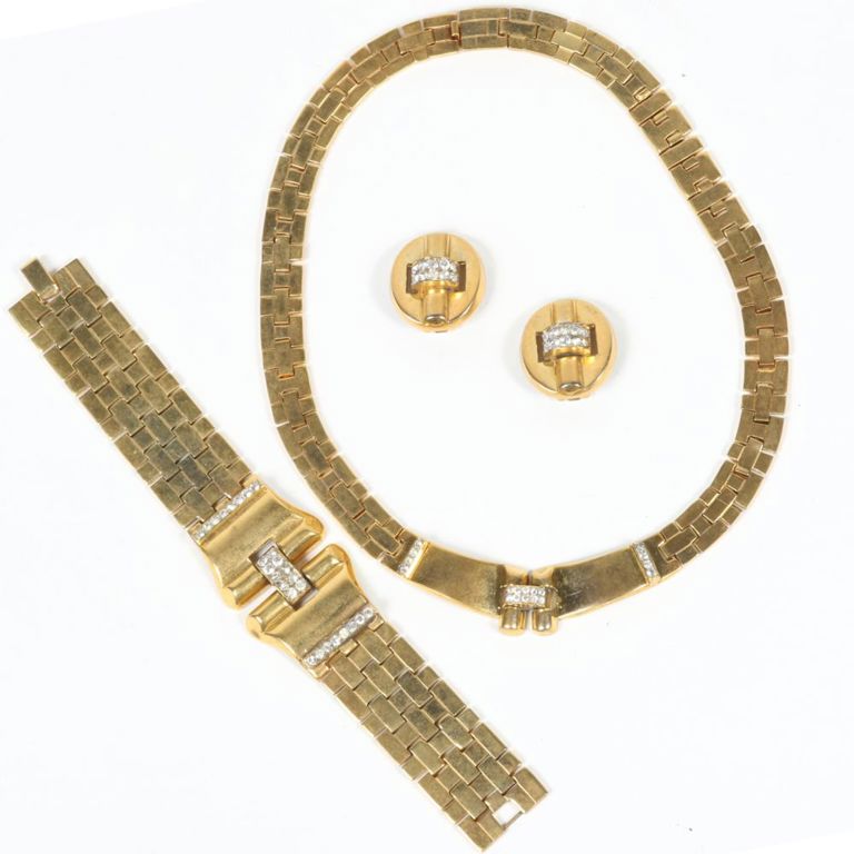 Gold tone metal and rhinestones necklace, bracelet, and earrings