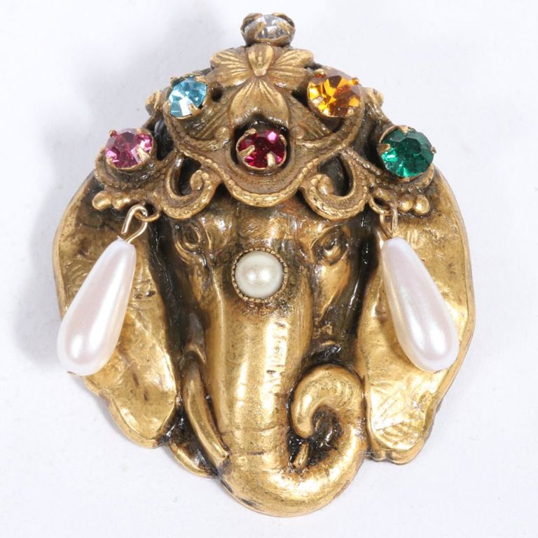 Gilt metal brooch with multi colored jeweled and pearl dangles.