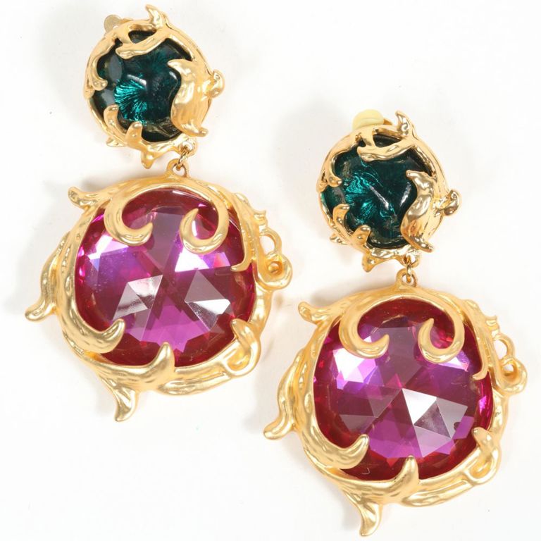 Gold tone metal earrings with green and pink jewels