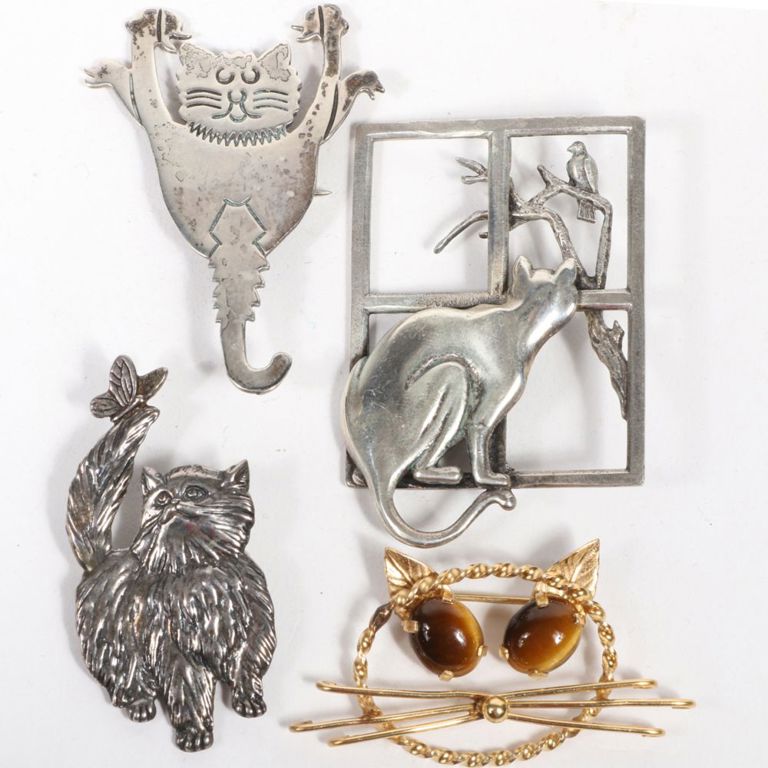 Four piece cat pin brooch group