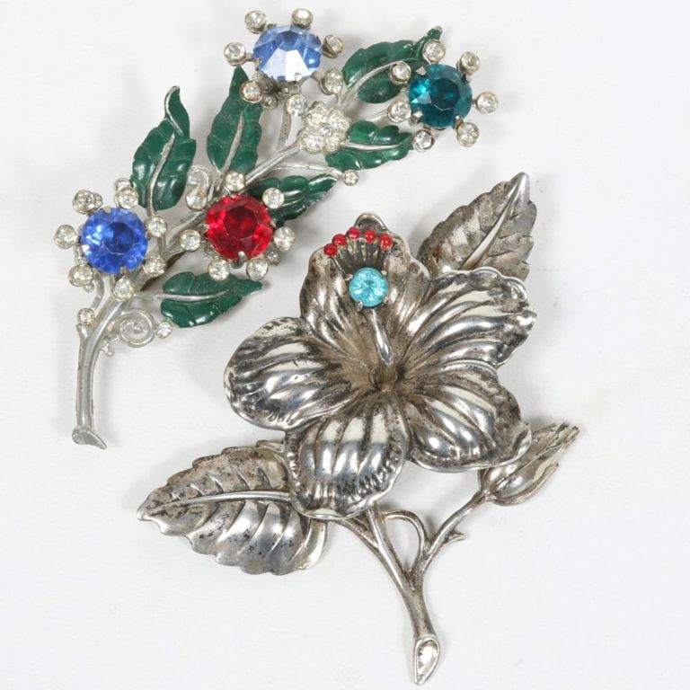 Two flower pin brooches with enamel and multi colored glass crystals