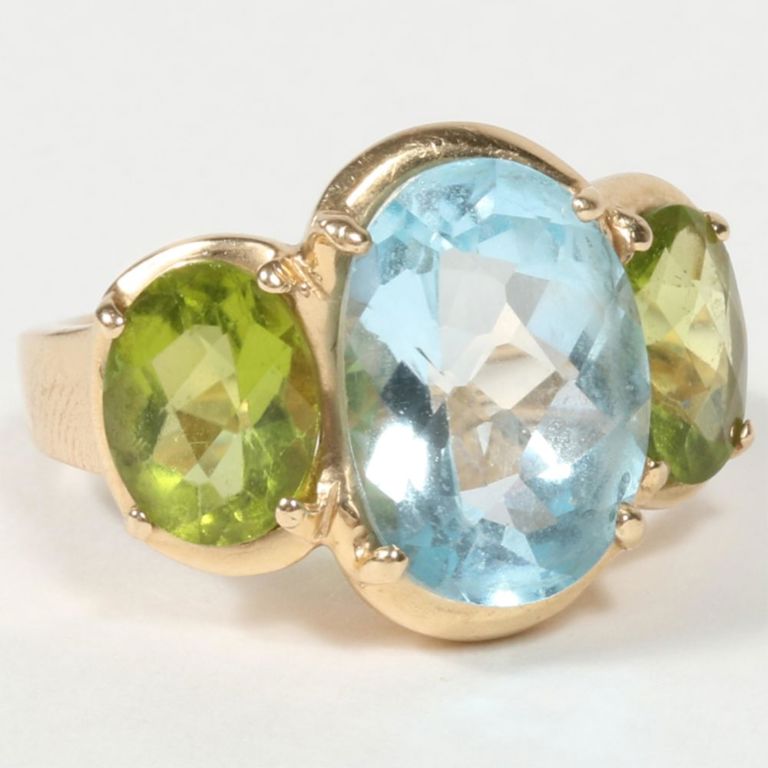 14k yellow gold ring with blue topaz and two peridot