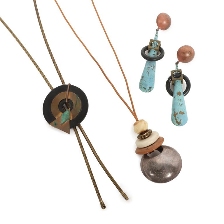 Bolo style necklace with sterling silver pendant on necklace and brass earrings