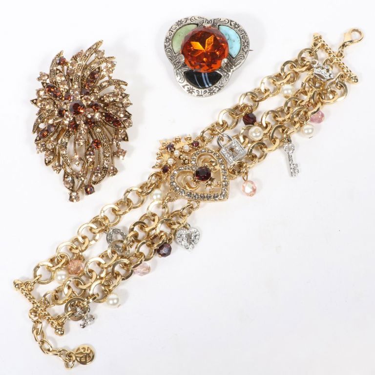 Jewelry set of bracelet and two brooches