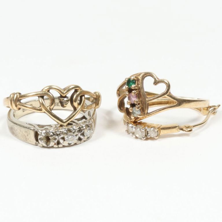Gold jewelry set of three rings and one earring