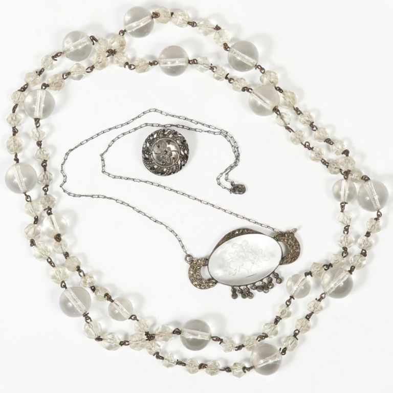 Jewelry set of two necklaces and brooch