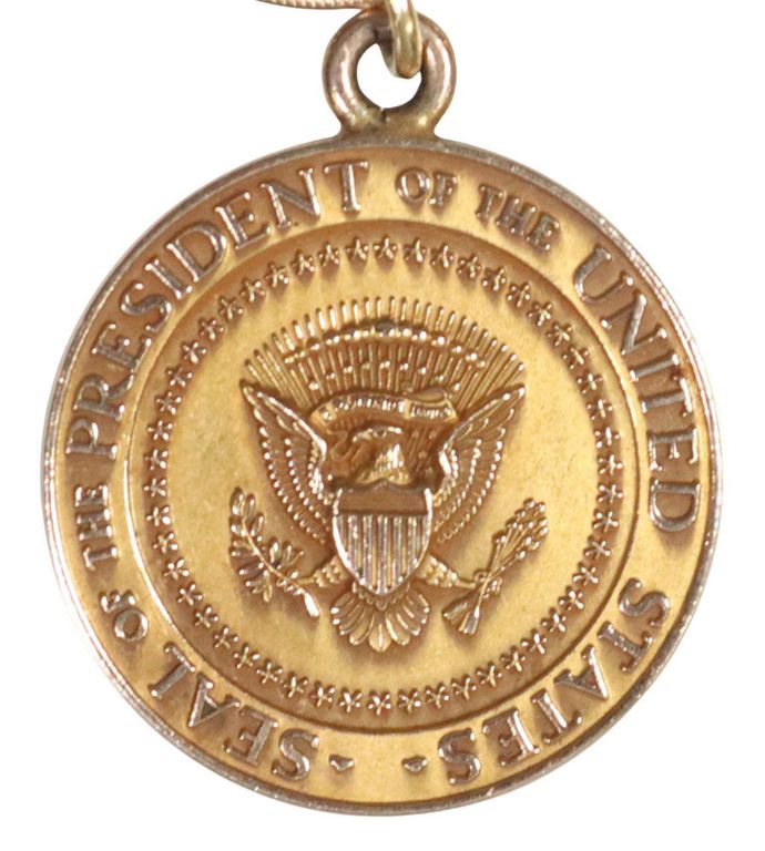 Estate 12kt gold-filled charm bracelet with presidential seal charm