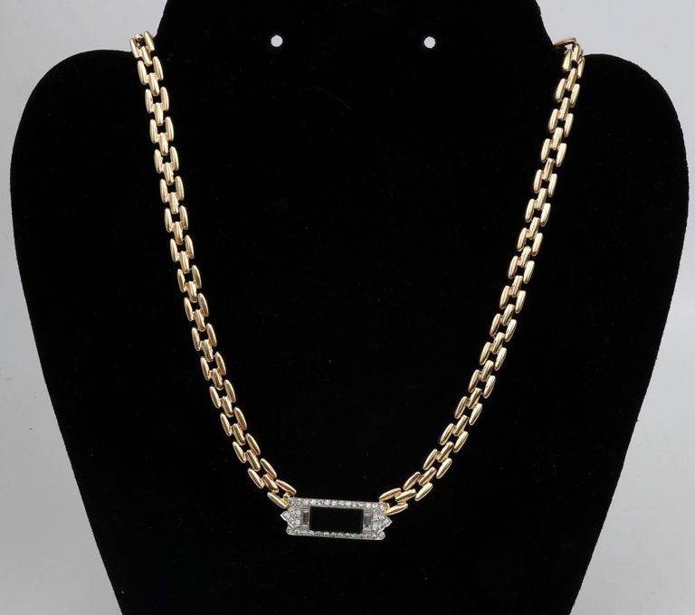 14k yellow gold chain with platinum pendant with onyx and diamonds