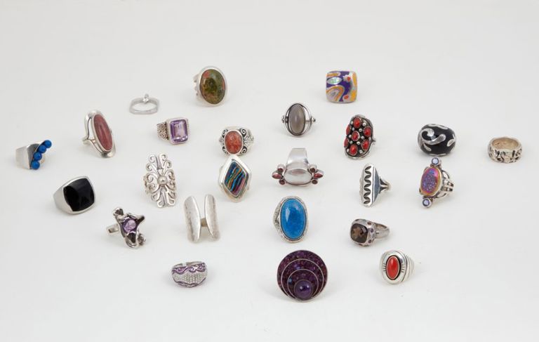 Collection of twenty-four silver and hardstone rings