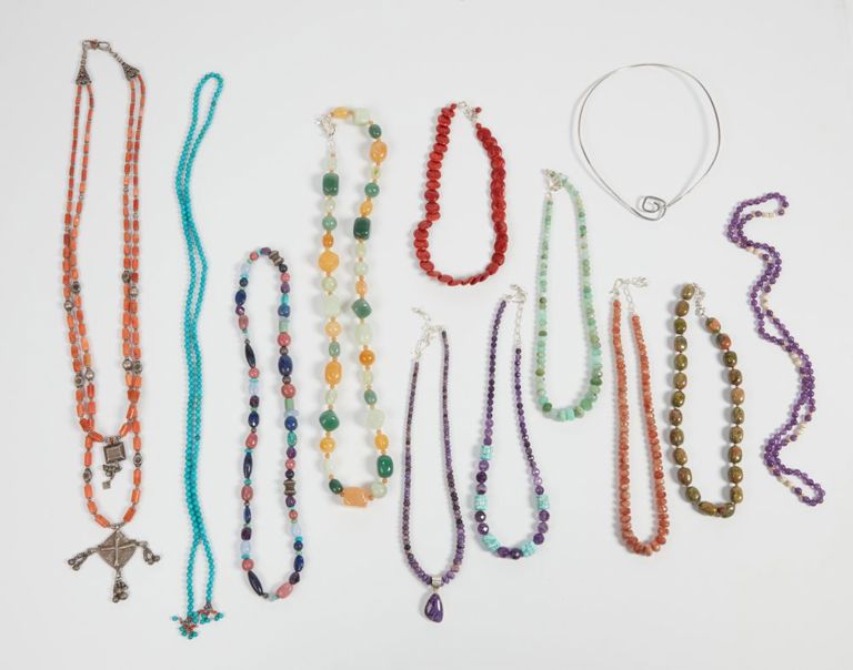 Collection of twelve silver, metal, and gemstone necklaces