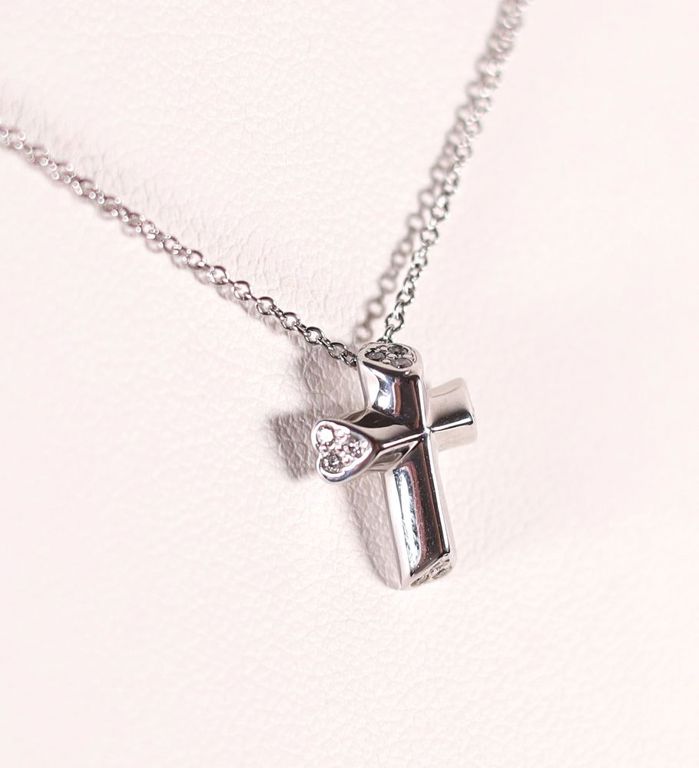 18k white gold diamond cross pendant on necklace