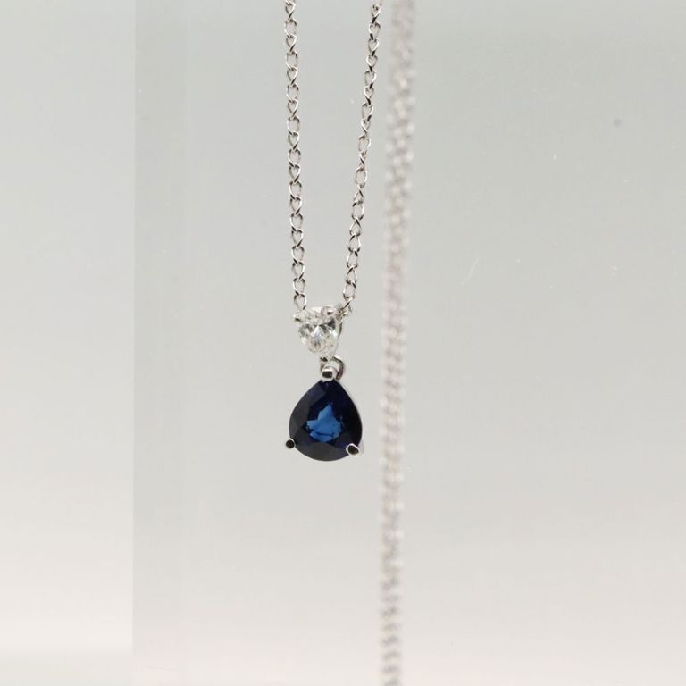 Platinum sapphire and diamond pendant on necklace