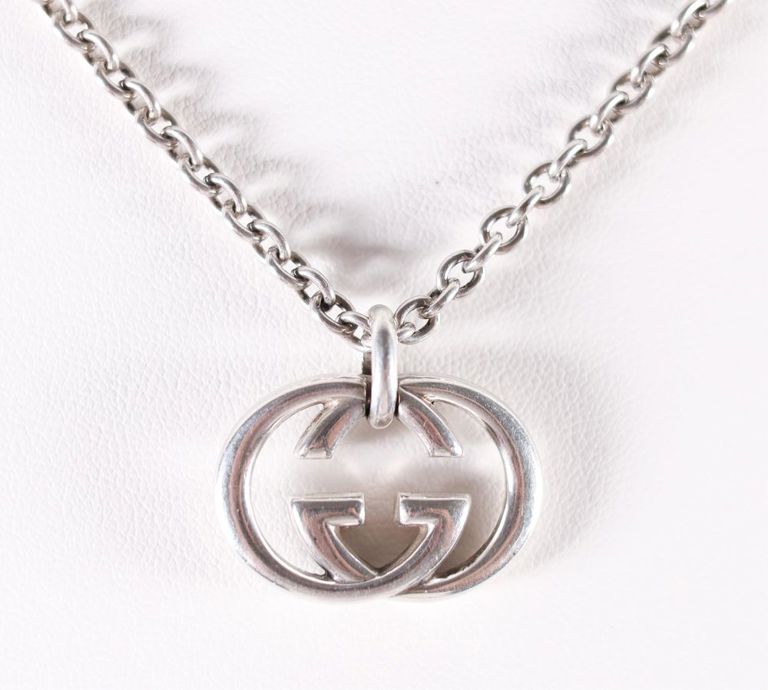 A Gucci sterling silver pendant on a necklace