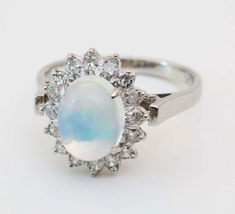 Platinum opal and diamonds halo ring
