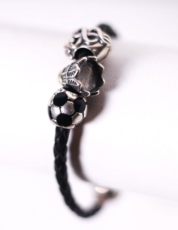 Black leather bracelet with sterling silver charms