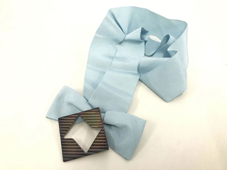 Vintage sterling silver brooch with a large ribbon
