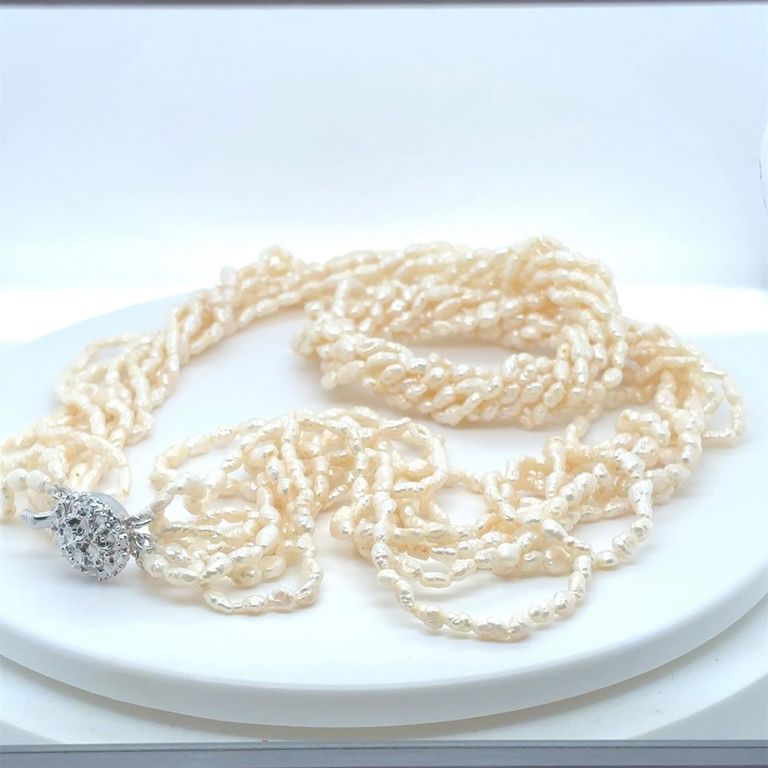 Multi-layer pearl necklace with a sterling silver clasp